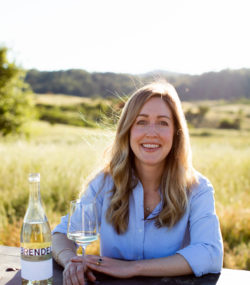 Brittany Sherwood at table with Brendel Chorus Cuvee Blanc and glass