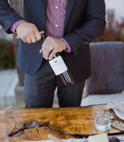 Bottle of Burgess Contadina being opened by man in suit